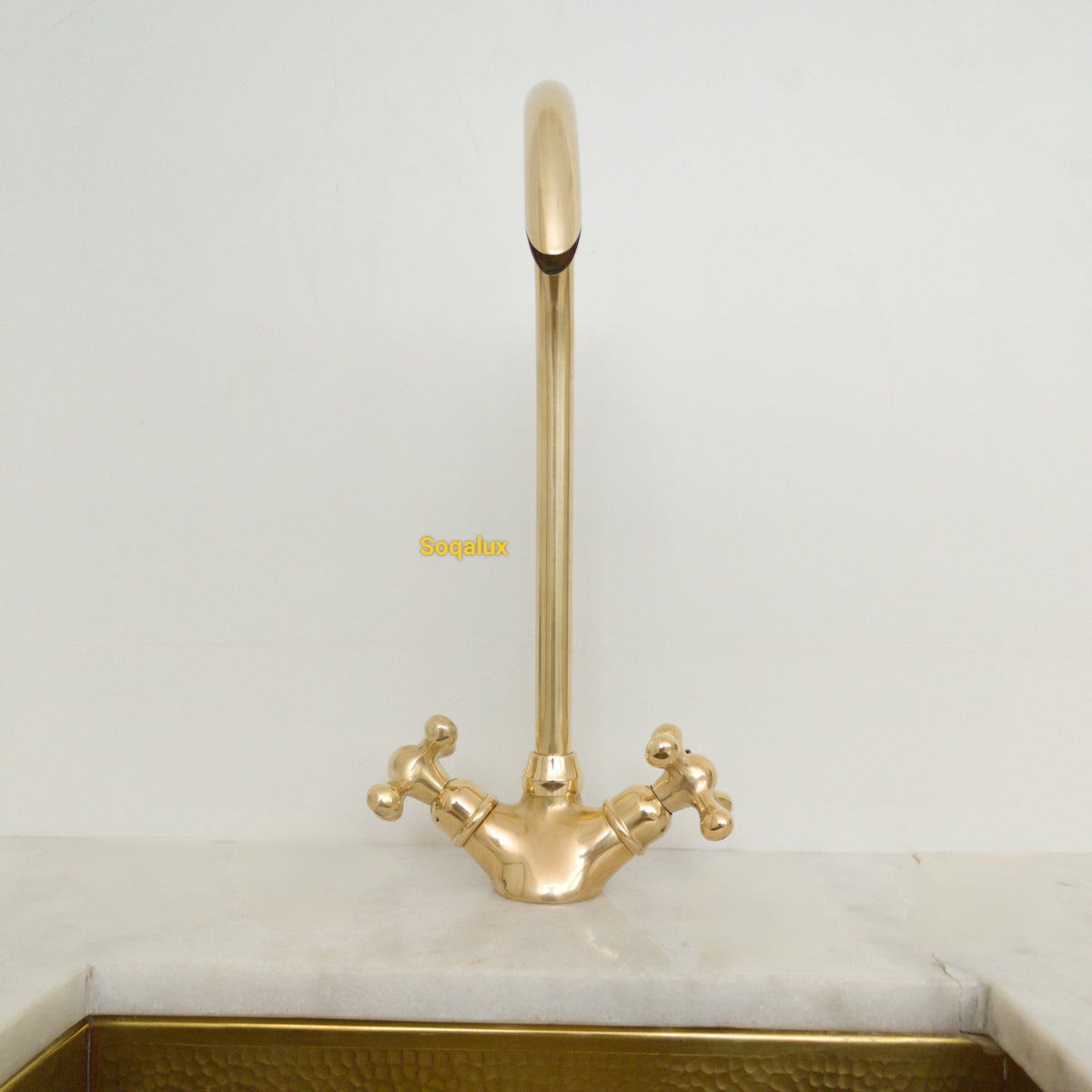 Unlacquered Solid brass kitchen faucet.