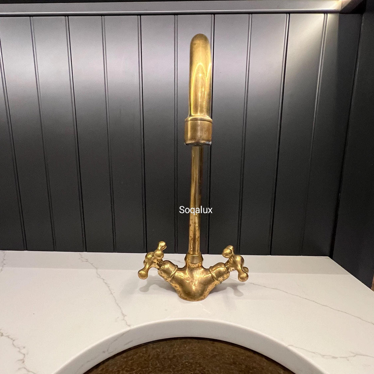 Unlacquered Solid brass kitchen faucet.