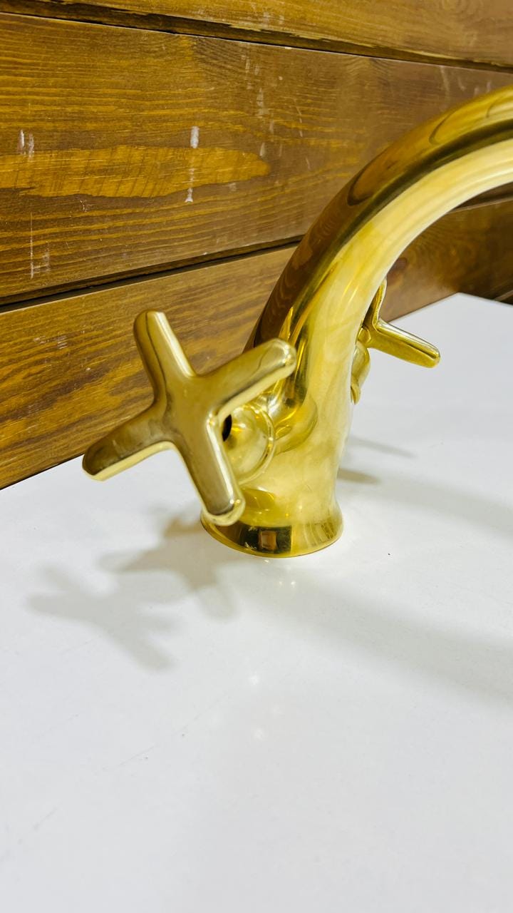 Unlacquered Brass Single-Hole Bathroom Faucet.