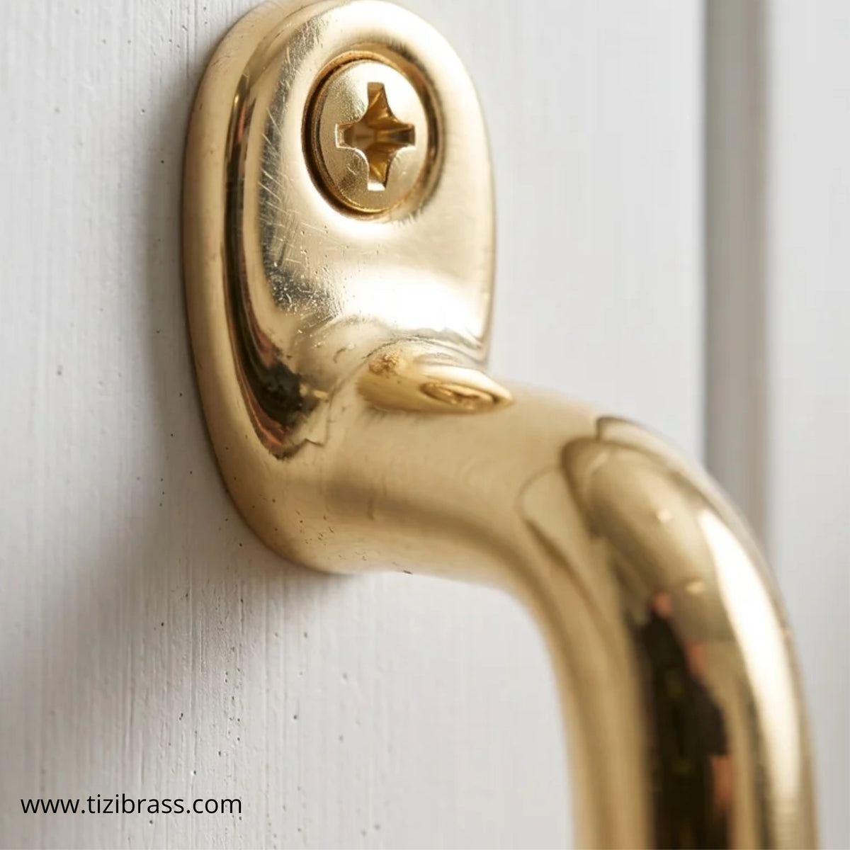 Unlacquered brass cabinet pull mounting detail, solid brass backplate and screw
